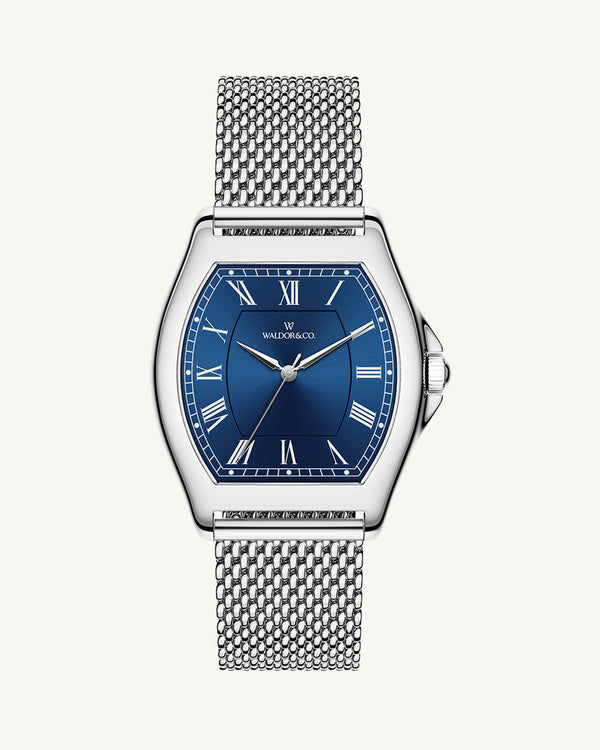 A tonneau mens watch in rhodium-plated silver from Waldor & Co. with blue sunray dial and a second hand. Seiko movement. The model is Constant 40 Lecco.