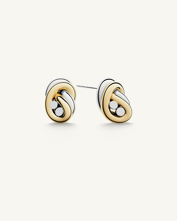 Earrings in silver and gold plated-316L stainless steel from Waldor & Co. The model is Dual Knot Earring Polished.