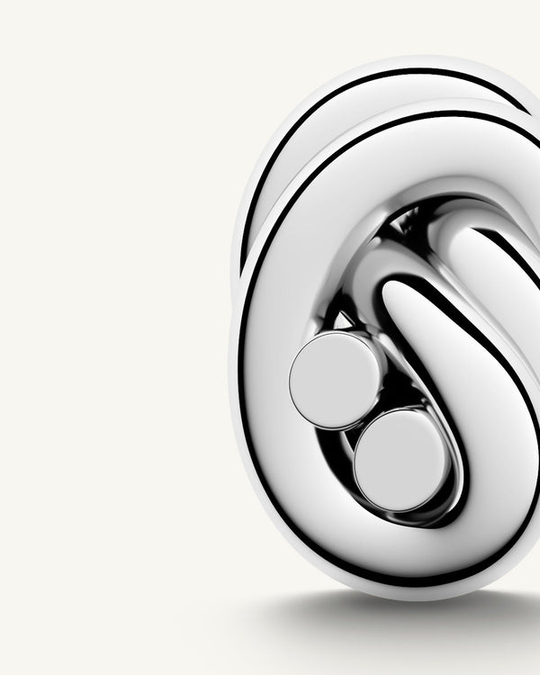 Earrings in silver plated-316L stainless steel from Waldor & Co. The model is Dual Knot Earring Polished.