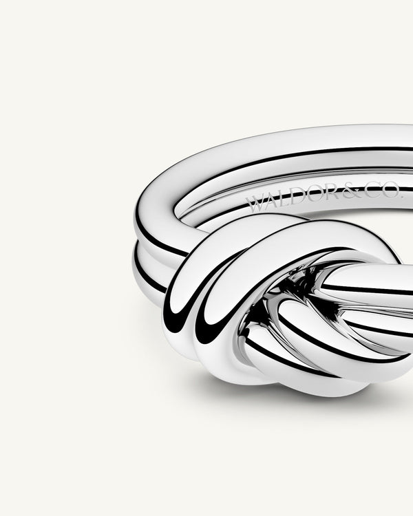 A Ring in Silver plated-316L stainless steel from Waldor & Co. The model is Dual Knot Ring Polished.