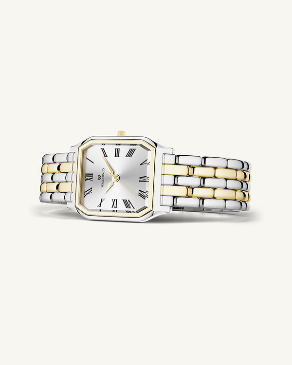 En fyrkantig damklocka i 22k guldpläterat 316L rostfritt stål från WALDOR & CO. med vit Diamond Cut Sapphire Crystal glass urtavla. Seiko urverk. Modellen är Eternal 22 Bellagio.