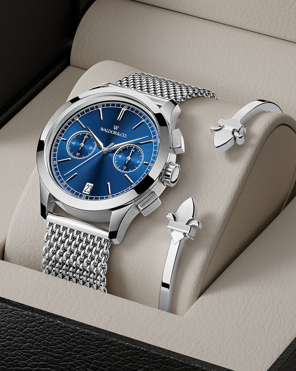 lifestyle_image, A round mens watch in rhodium-plated silver from Waldor & Co. with blue sunray dial and a second hand. Seiko movement. The model is Chrono 44 Sardinia 44mm.