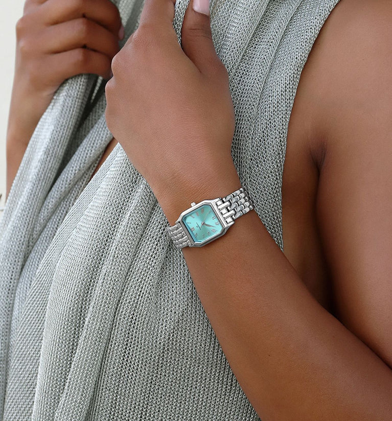 The turquoise dial takes center stage