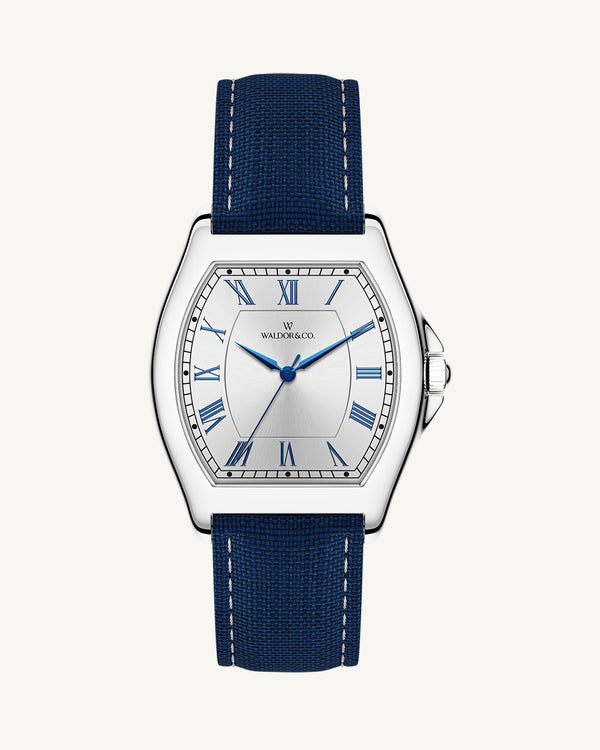 A square mens watch in Rhodium-plated 316L stainless steel from Waldor & Co. with white dial. Blue sailcloth strap. Ronda movement. The model is Constant 40 Tremezzo 37x45mm.