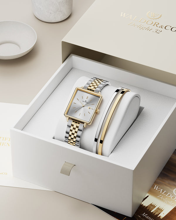 lifestyle_image,A square womens watch in silver and 14k gold from Waldor & Co. with silver sunray dial and a second hand. Seiko movement. The model is Delight 32 Chelsea 28x32mm.