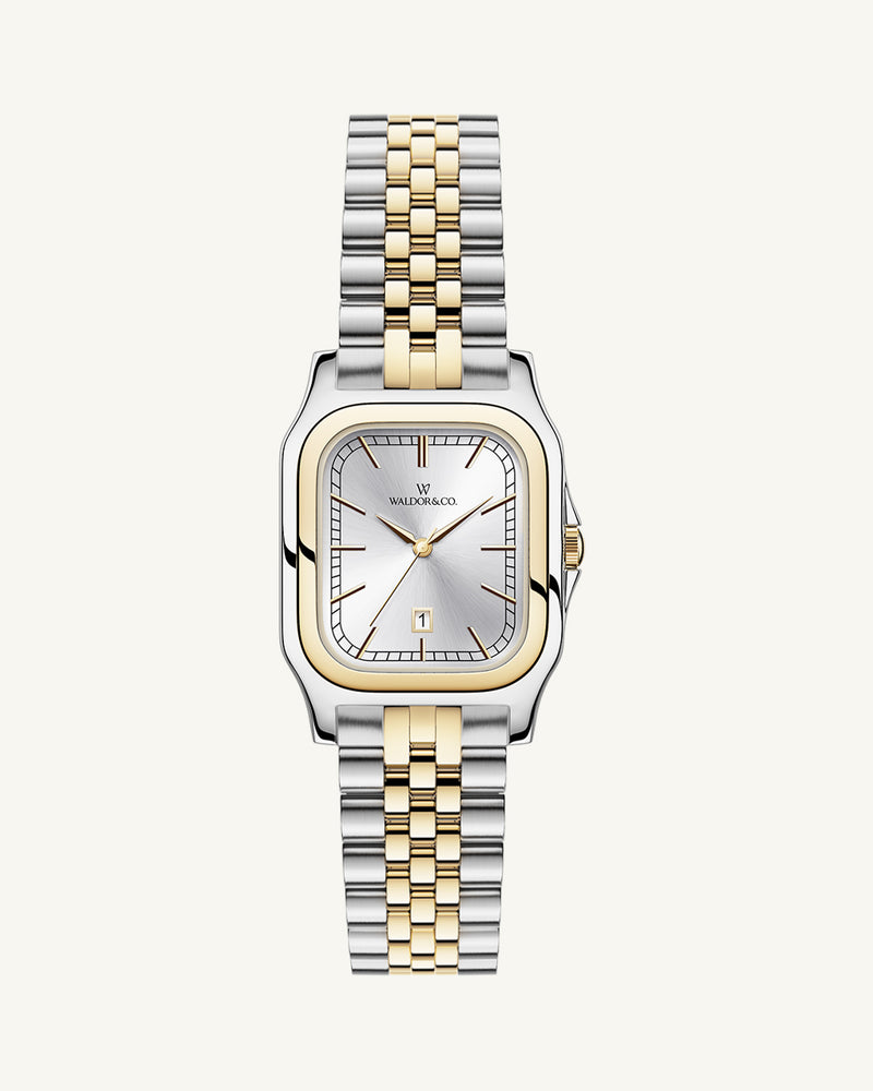 A square womens watch in silver and 14k gold from Waldor & Co. with silver sunray dial and a second hand. Seiko movement. The model is Delight 32 Chelsea 28x32mm.