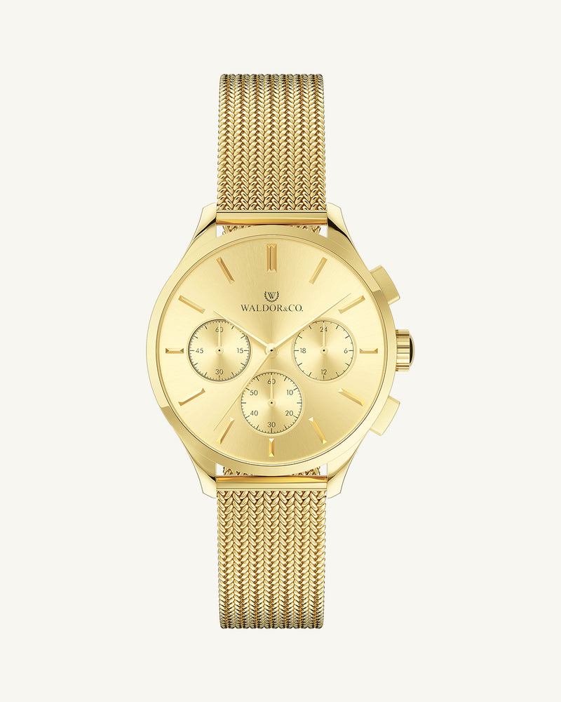 A round womens watch in 22k gold from Waldor & Co. with gold sunray dial and a second hand. Seiko movement. The model is Epoch 36 Formentera 36mm.