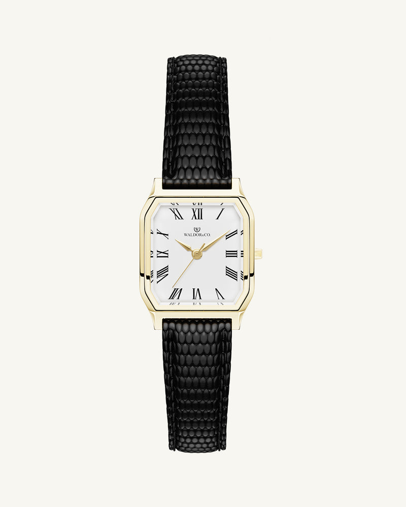 A square womens watch in 22k gold from Waldor & Co. with white Diamond Cut Sapphire Crystal glass dial. Strap in black Genuine leather. Seiko movement. The model is Eternal 22 Varenna. 