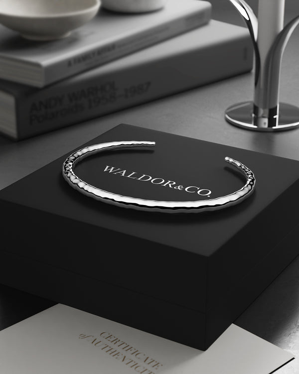 A Round Bangle in 925 Sterling Silver from Waldor & Co. The model is Opal Bangle Sterling Silver