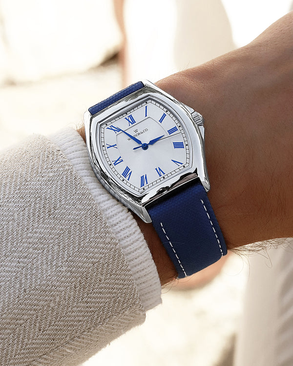  A square mens watch in Rhodium-plated 316L stainless steel from Waldor & Co. with white dial. Blue sailcloth strap. Ronda movement. The model is Constant 40 Tremezzo 37x45mm.