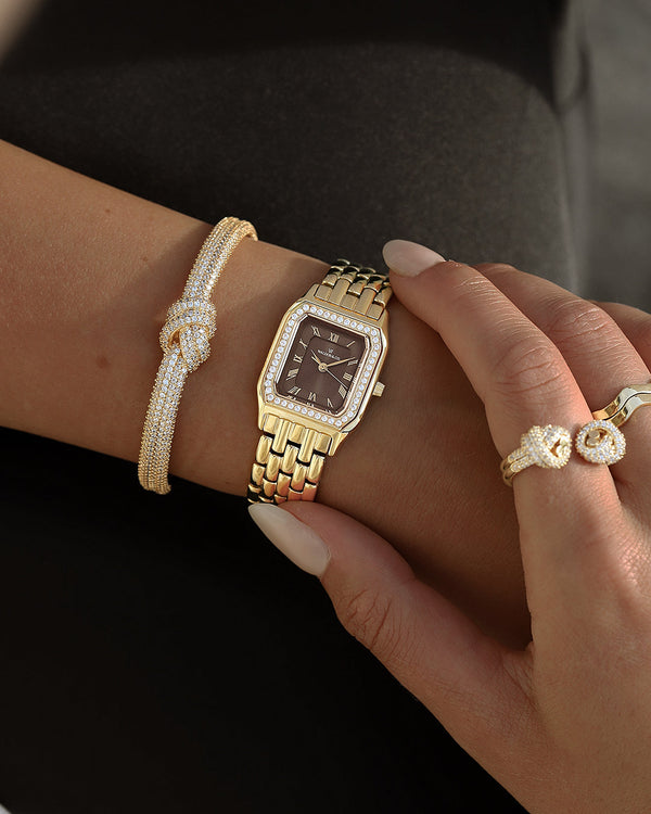 lifestyle_image, A square womens watch in Rhodium-plated 316L stainless steel from Waldor & Co. with a deep brown dial. Bezel with premium crystals. Diamond Cut Sapphire Crystal glass dial. Seiko movement. The model is Eternal 22 Bellagio Pavè.