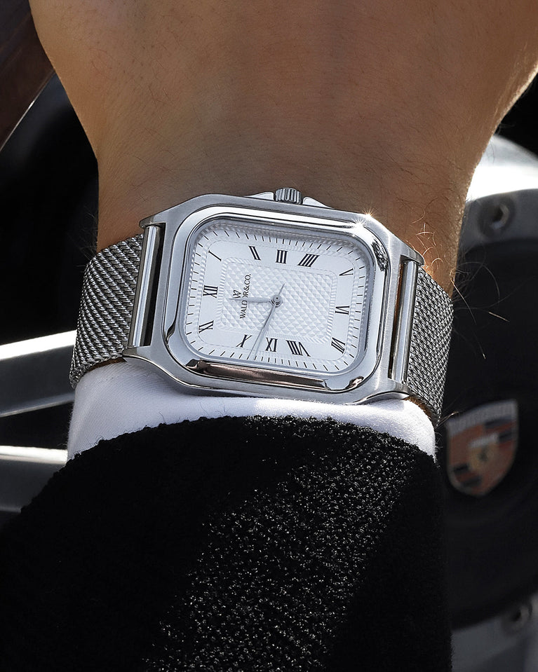  A square mens watch in silver from Waldor & Co. with silver dial and a second hand. Seiko movement. The model is Montel 40 Camogli.