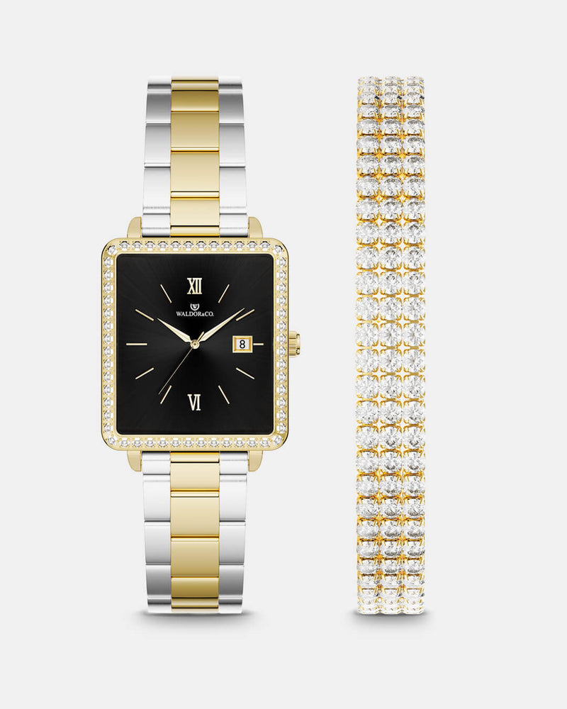 A square womens watch in 22k gold-plated 316L stainless steel with stones from WALDOR & CO. with black sunray dial and a second hand. Seiko VJ22 movement. The model is Delight 32 Mayfair Ltd. Edition 28x32mm. 